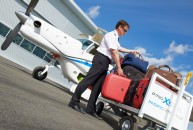 Pilot loading luggage